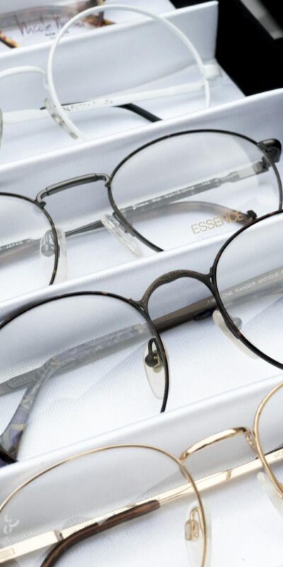 Close-up of assorted eyeglasses showcased in an orderly fashion for selection.