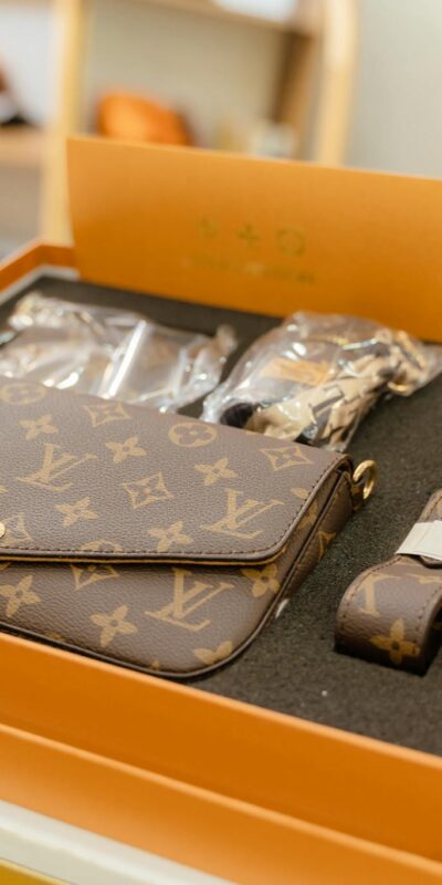 High-end Louis Vuitton monogram bag set displayed in a luxury boutique.