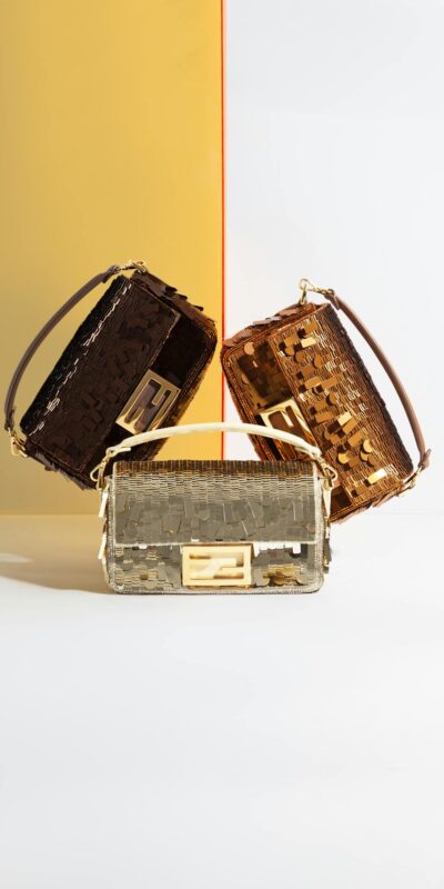 Three stylish handbags in a geometric reflective setup with a vibrant backdrop.